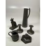 A quantity of Arts & Crafts pewter items to include a pair of candle sticks, an inkwell, a jug and