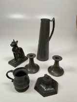 A quantity of Arts & Crafts pewter items to include a pair of candle sticks, an inkwell, a jug and