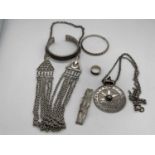 A small group of Omani silver jewellery, including circular pendant on chain, necklace, bangle, etc,