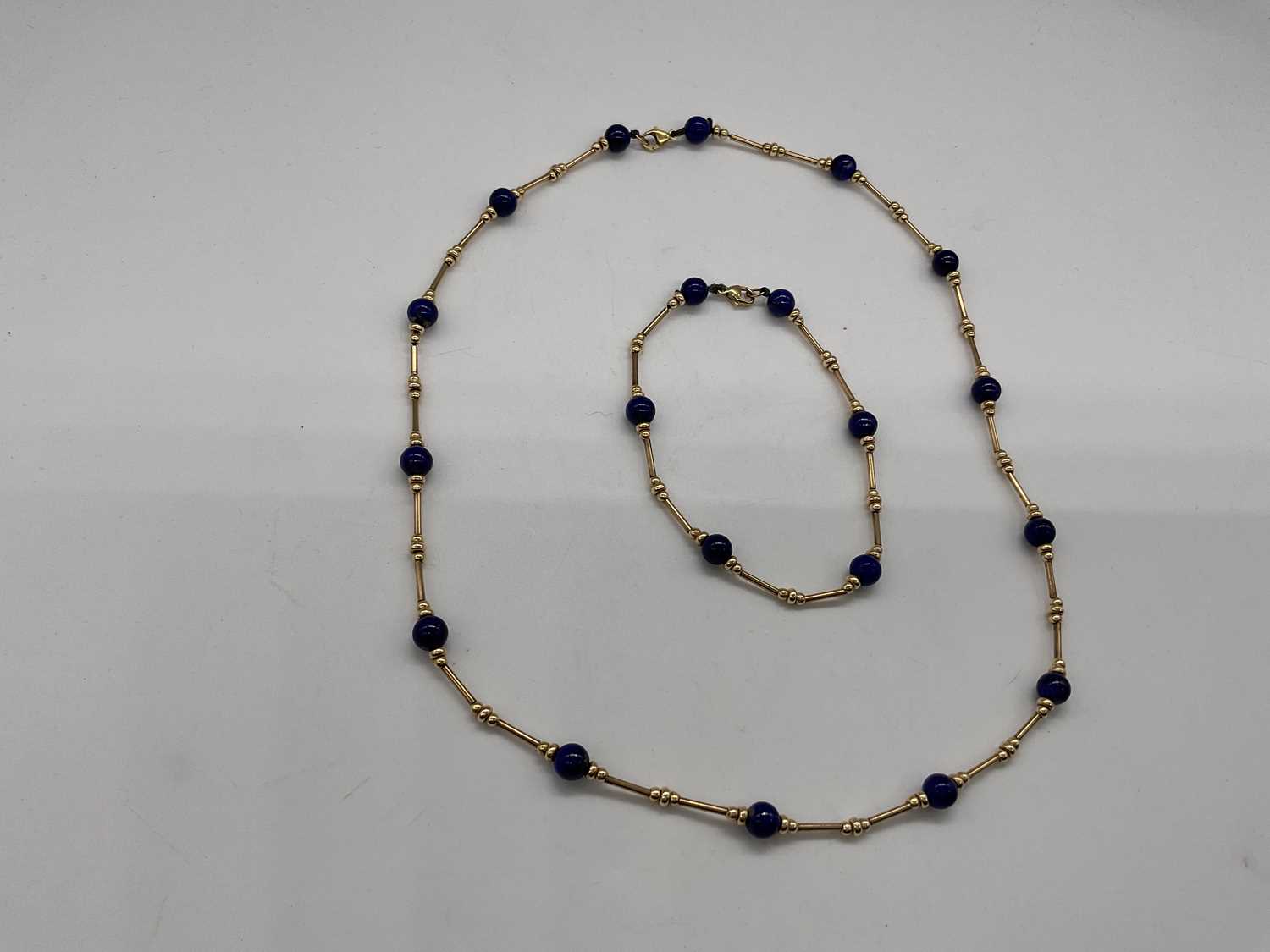 A 9ct yellow gold chain and bracelet set with bead spacers and blue roundels, necklace length - Image 3 of 3