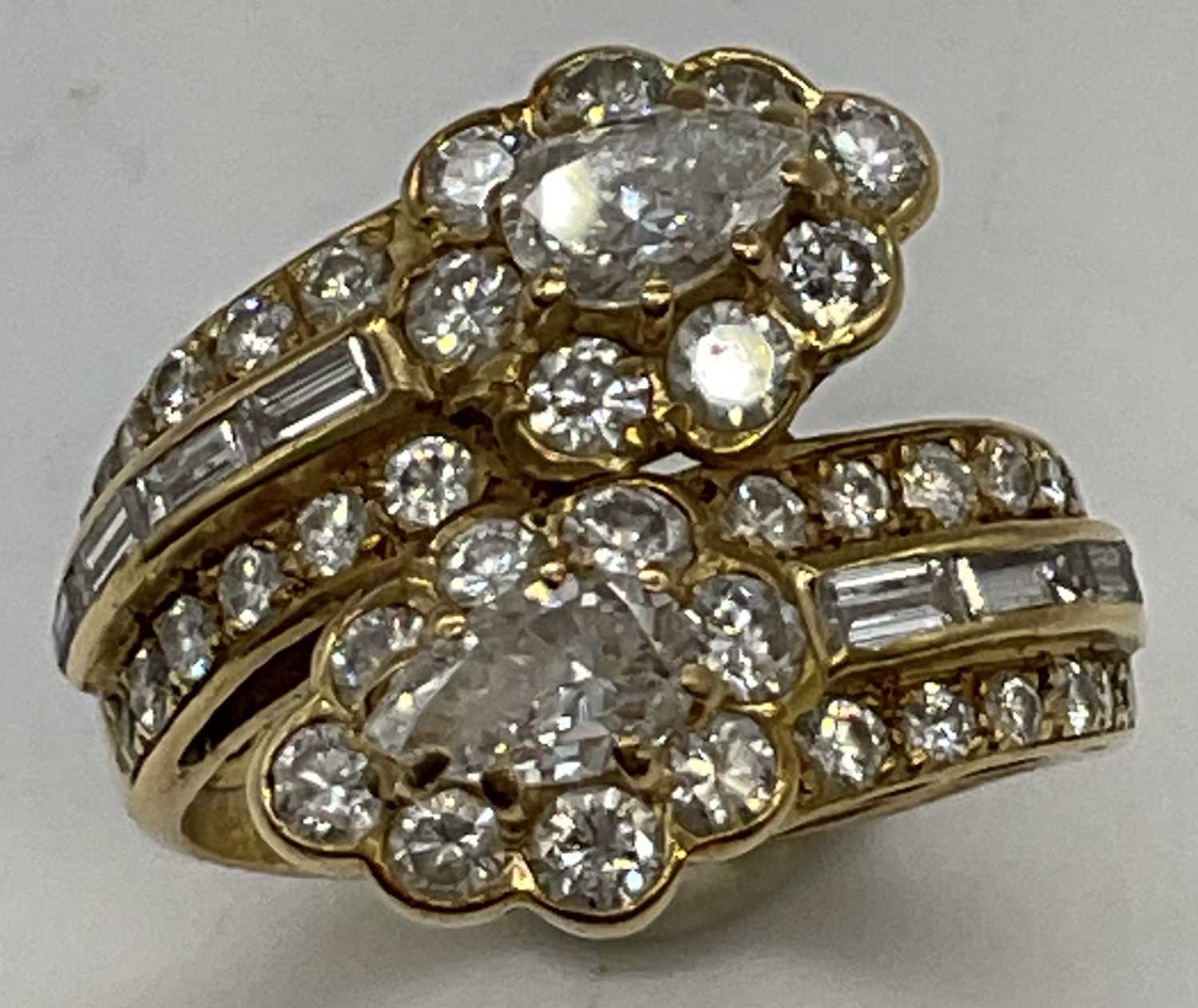 A yellow metal and diamond set crossover ring, each main section set with a pear shaped diamond each - Image 3 of 6