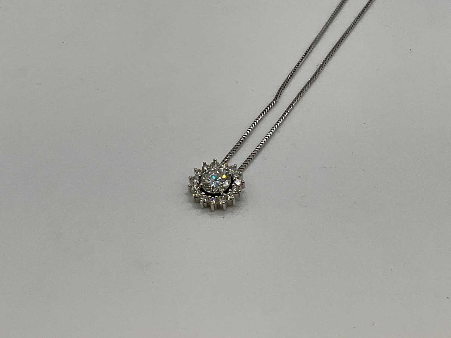 A fine 18ct white gold diamond pendant, the central round brilliant cut stone weighing 2.01cts ( - Image 2 of 5