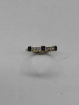 A yellow metal sapphire and diamond dress ring of Art Deco design, size K, approx. 1g.