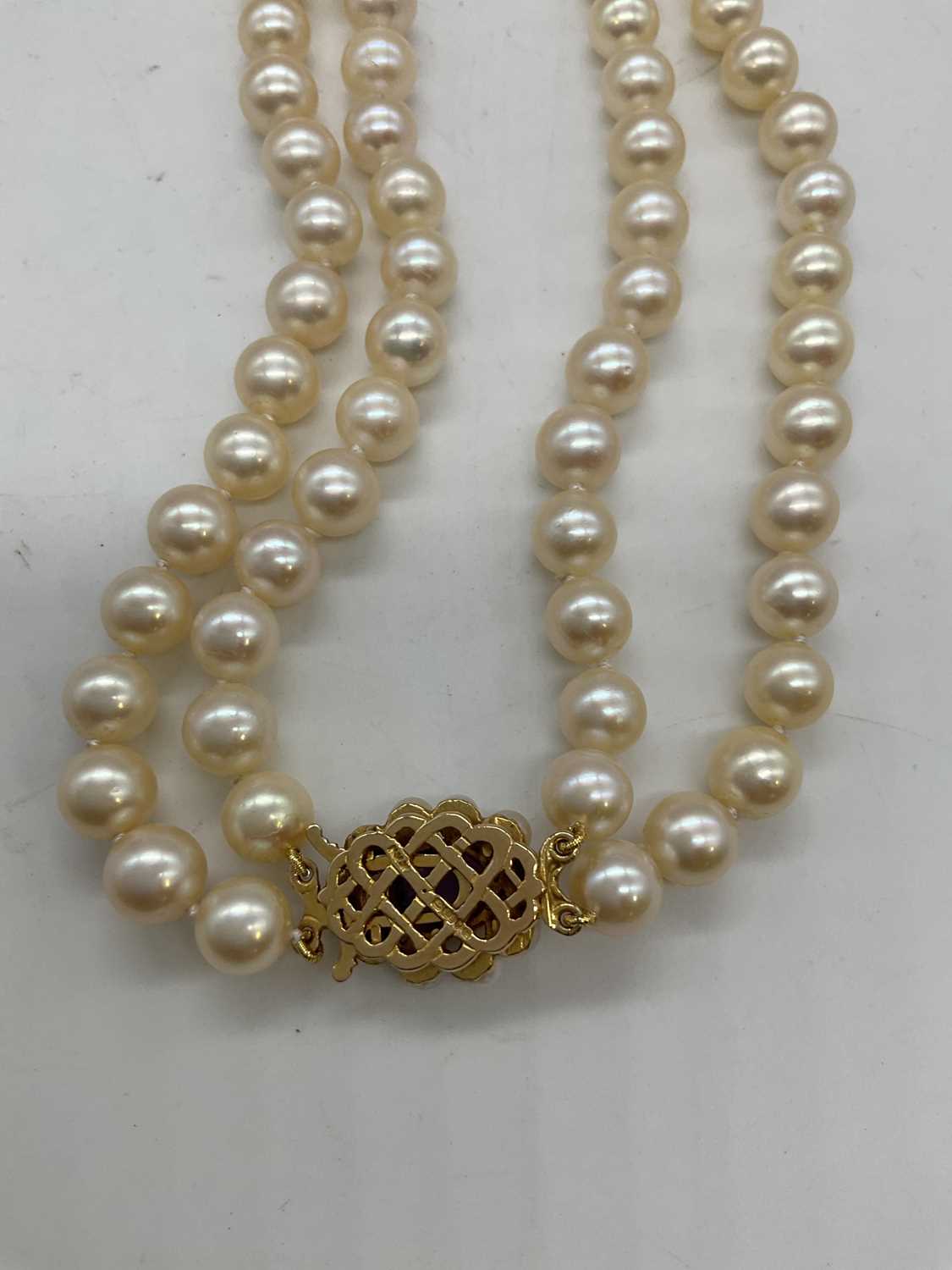 A hand tied double strand of pearls with 9ct yellow gold amethyst and pearl clasp, length 40cm, - Image 3 of 4