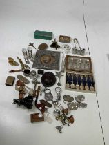 A collectors' lot including a decorative Chinese white metal frame, opera glasses, vintage tin,