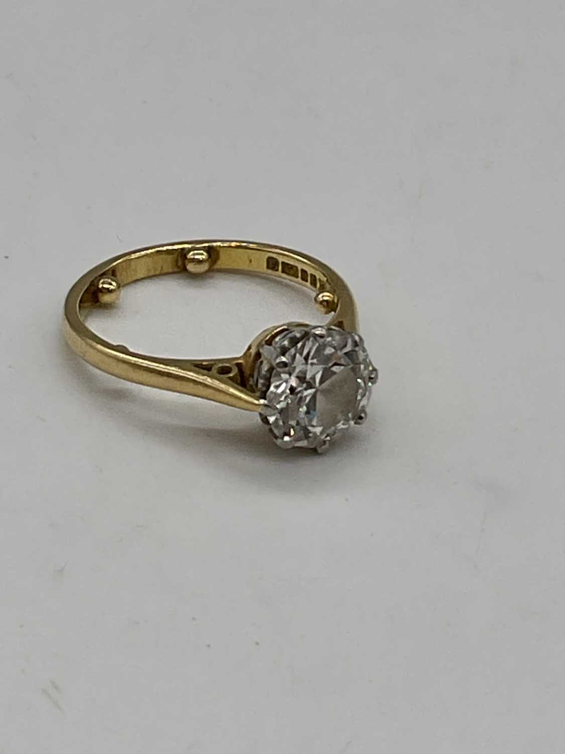 An 18ct yellow gold diamond solitaire ring, the eight claw set round brilliant cut stone approx. - Image 2 of 5
