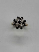 A 9ct yellow gold sapphire and diamond stepped floral cluster ring, size Q, approx. 3.9g.