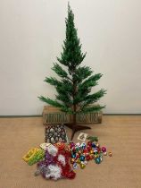 A vintage Christmas tree, height 142cm, with original box and decorations.