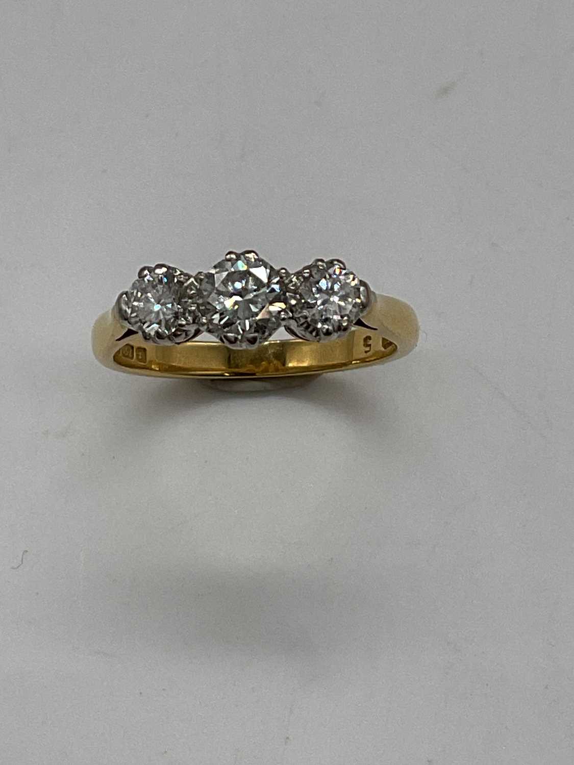 An 18ct yellow gold three stone graduated diamond ring, the centre stone approx. 0.40cts, size J 1/ - Image 2 of 4