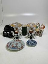 A quantity of ceramics comprising a pair of Staffordshire cat vases, Chinese plates, and other