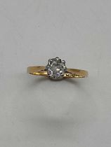 An 18ct yellow gold diamond solitaire ring, the cushion cut stone approx. 0.5cts. size M 1/2,