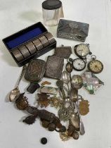 A group of collectors' items including mother of pearl card case, cap badges, sections of