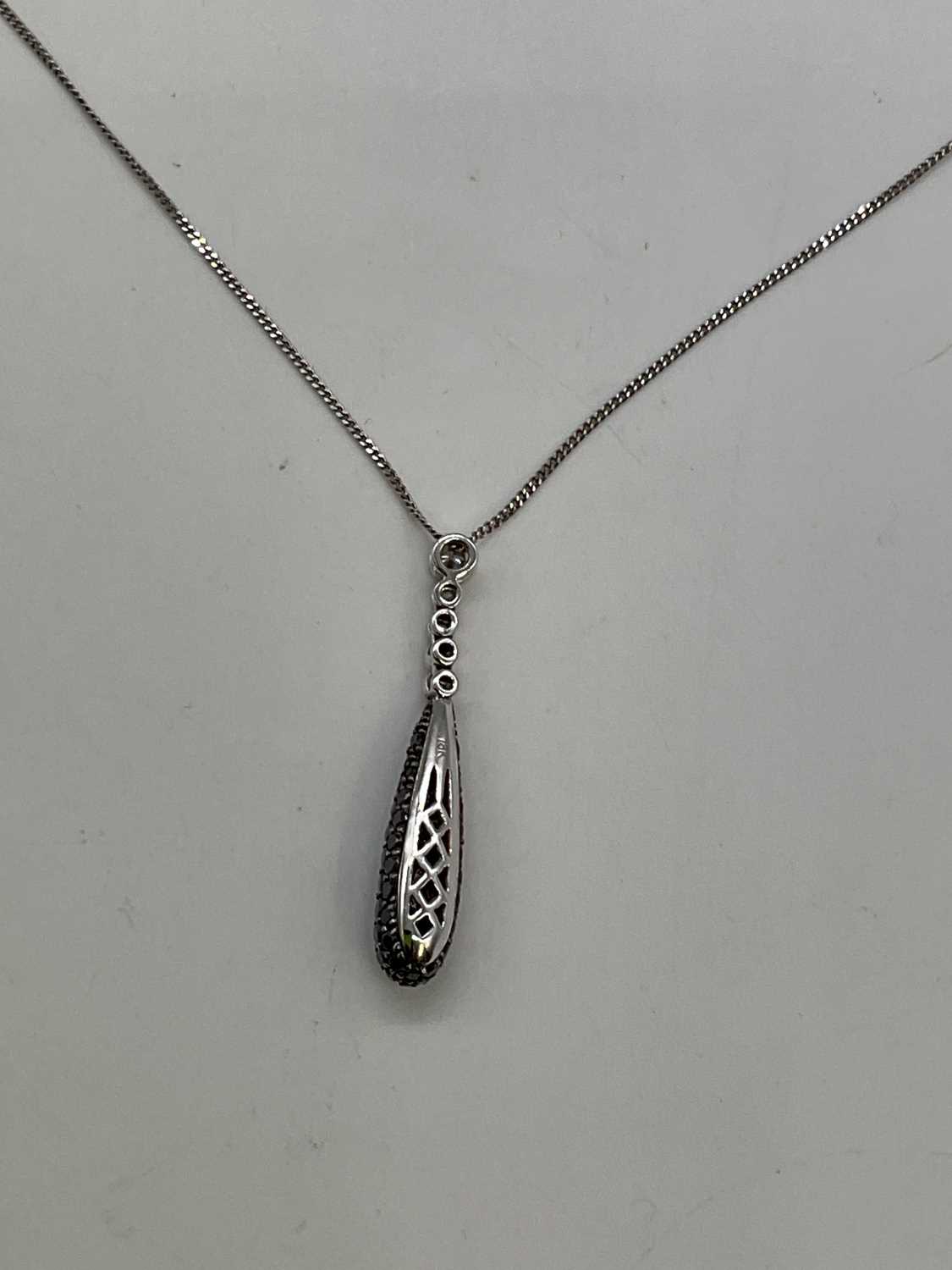 An 18ct white gold black and white diamond pendant, the drop set with seventy-two round brilliant - Image 3 of 3