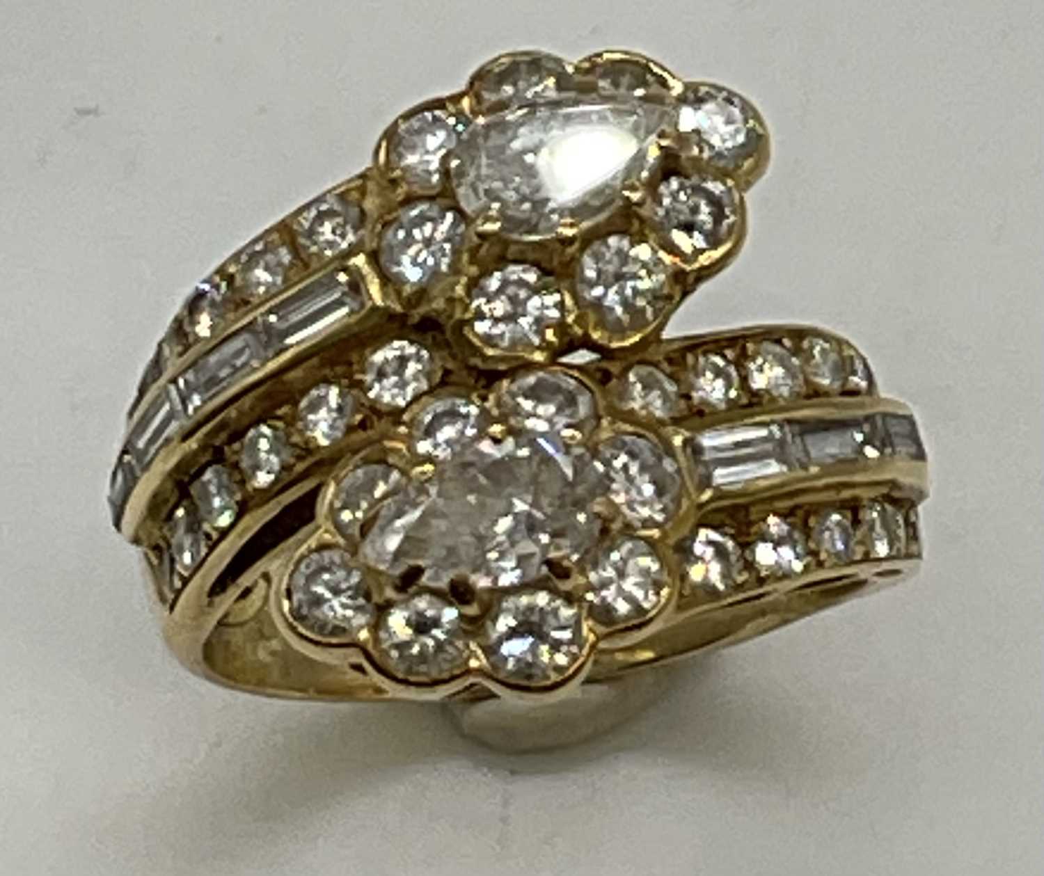 A yellow metal and diamond set crossover ring, each main section set with a pear shaped diamond each - Image 5 of 6