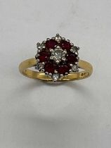 An 18ct yellow gold ruby and diamond dress ring, size O 1/2, approx. 4.6g.