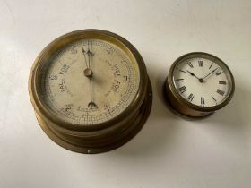 A Sestral barometer, face diameter 18cm, and a ship's clock, no maker's mark, 10cm diameter
