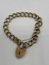 A 9ct yellow gold curb link bracelet with padlock clasp, approx. 16.5g.