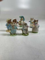 Eight Bewick Beatrix Potter figures to include, Miss Poppet, dated to the underside, 1954; Tom