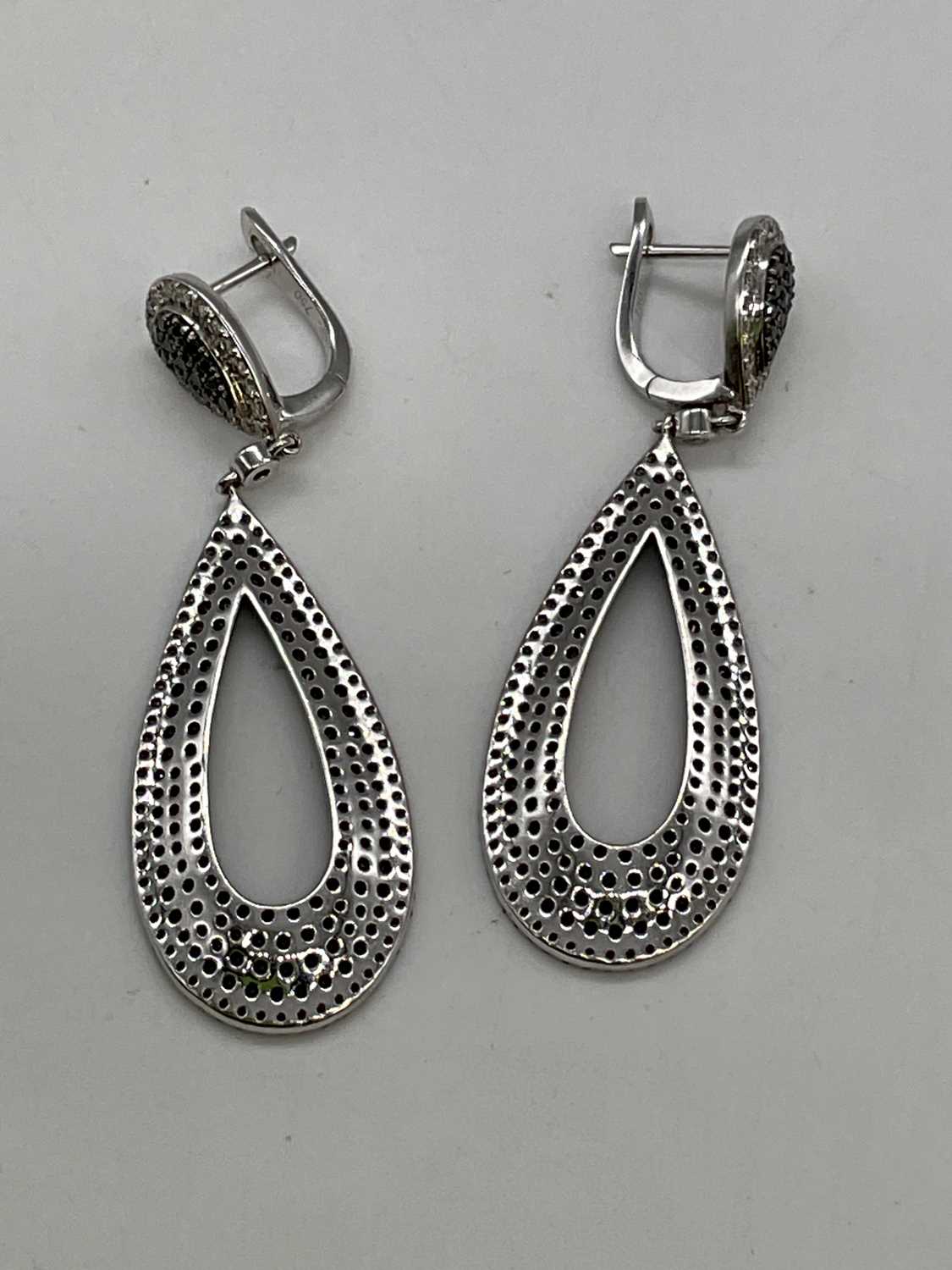 A pair of 18ct white gold black and white diamond set pierced drop earrings combined set with two - Image 2 of 2