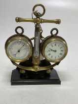 A circa 1900 novelty brass weather station centred with an anchor set with thermometer flanked by