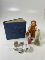 Collectors' items including an album of vintage postcards, two vintage half doll clothes brushes,