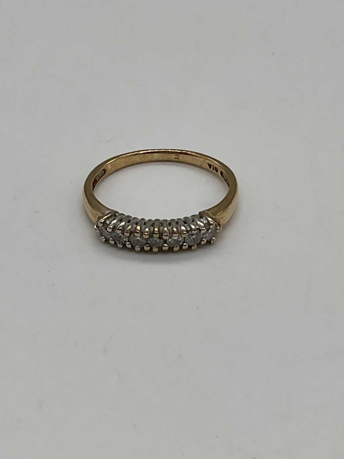 A 9ct yellow gold half eternity ring set with seven small diamonds, size O, approx. 1.65g. - Image 2 of 4