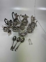 A group of silver plate, including two tea sets, also a pierced dish and a pair of silver sugar