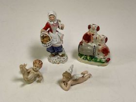 A Meissen figure of a woman carrying a basket of breads, height 13cm high, two Continental porcelain