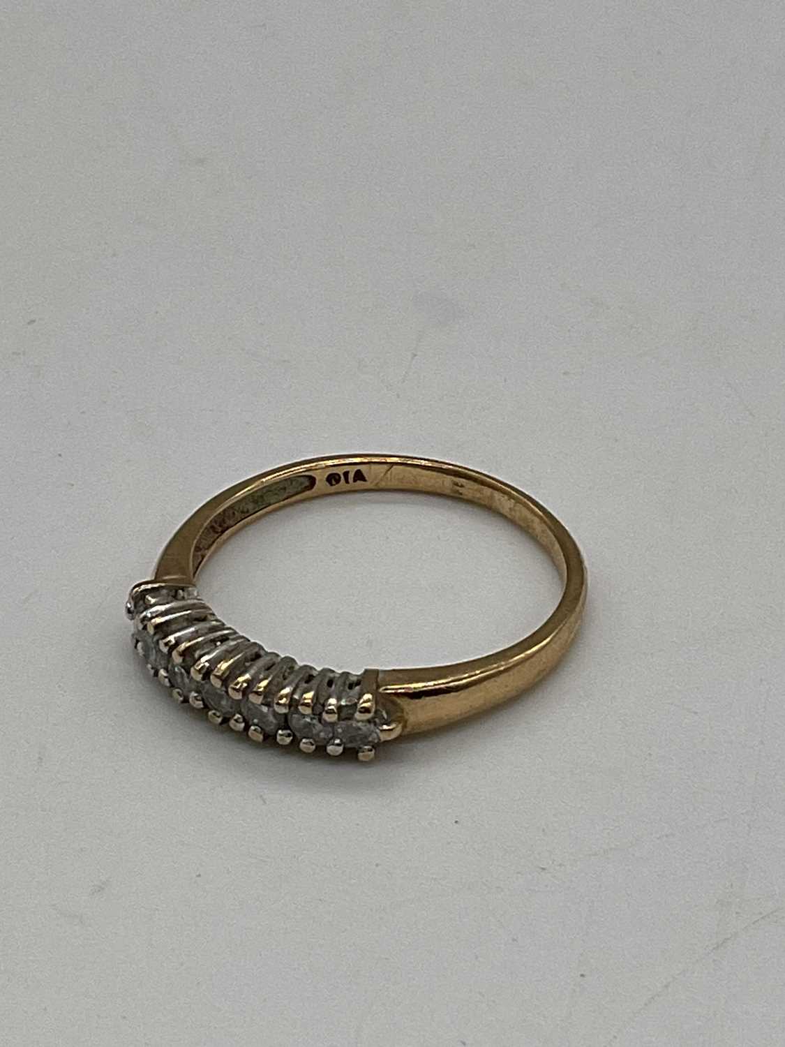 A 9ct yellow gold half eternity ring set with seven small diamonds, size O, approx. 1.65g. - Image 3 of 4