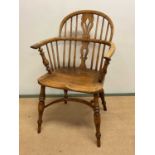 An oak farm chair with crinoline stretcher, width 57cm, seat height 44cm, seat depth 39cm, back rest