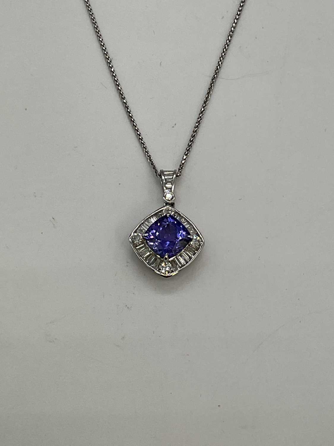 An 18ct white gold diamond and tanzanite pendant, the cushion cut tanzanite weighing 2.57cts - Image 2 of 4