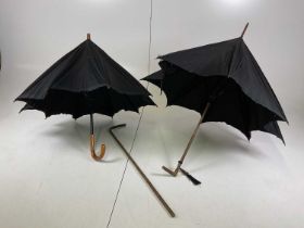 Two vintage umbrellas and a walking stick (af).