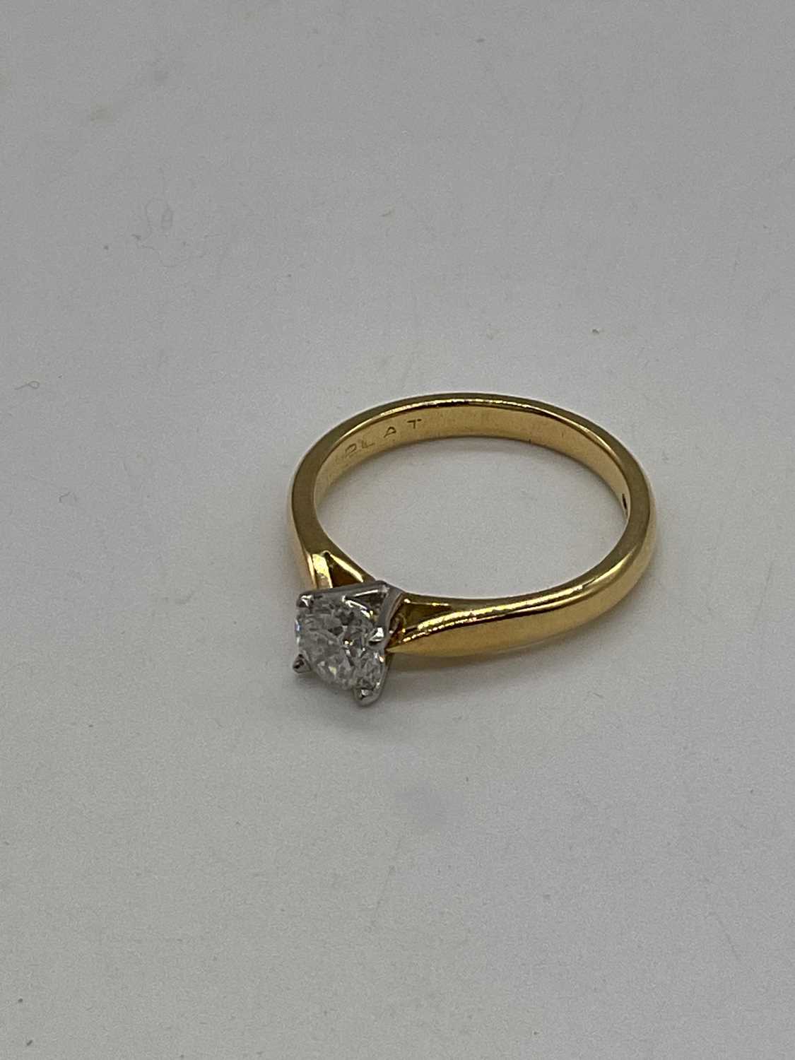 An 18ct yellow gold diamond solitaire ring, the four claw set round brilliant cut stone approx. 0. - Image 3 of 3