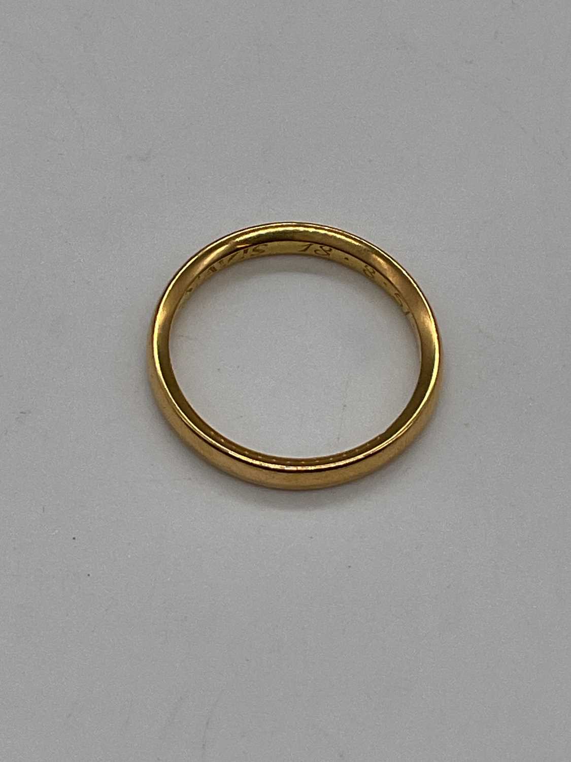 A yellow metal wedding band with inscription engraved to the inner band, size L, approx. 3.4g. - Image 3 of 3