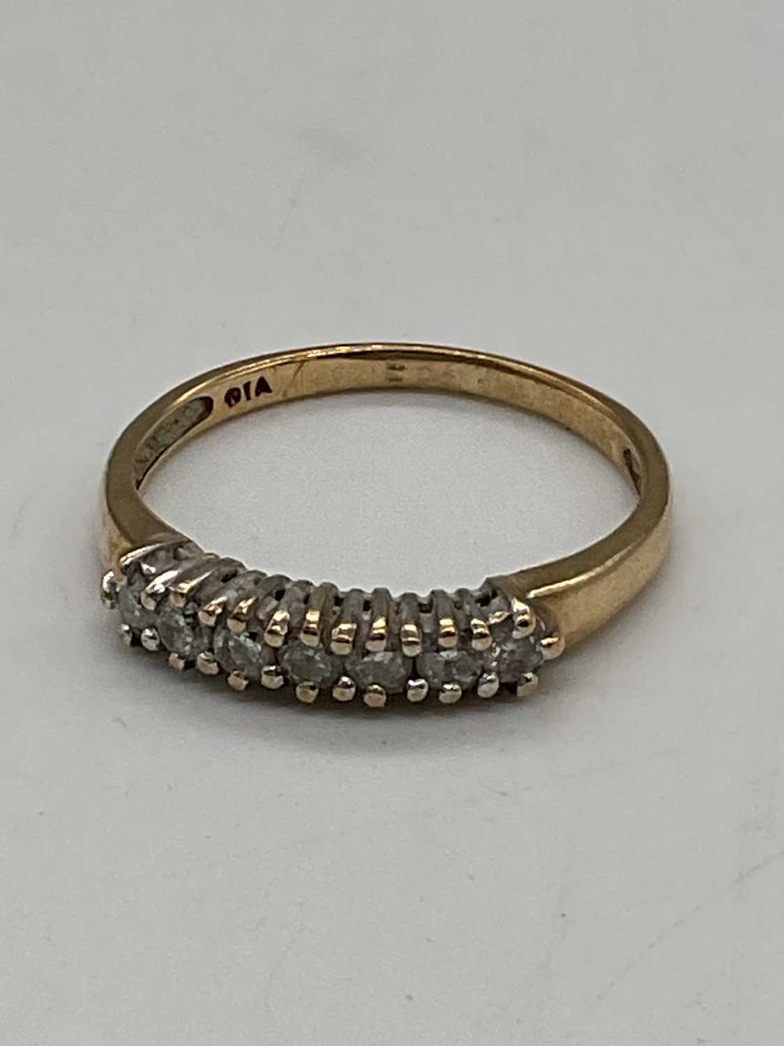 A 9ct yellow gold half eternity ring set with seven small diamonds, size O, approx. 1.65g. - Image 4 of 4