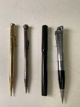 A silver propelling pencil, vintage pen, two further pencils, and a pocket knife.