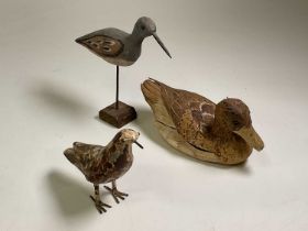 Three various decoy ducks, one painted metal, one hand painted wood on a metal rod and the other
