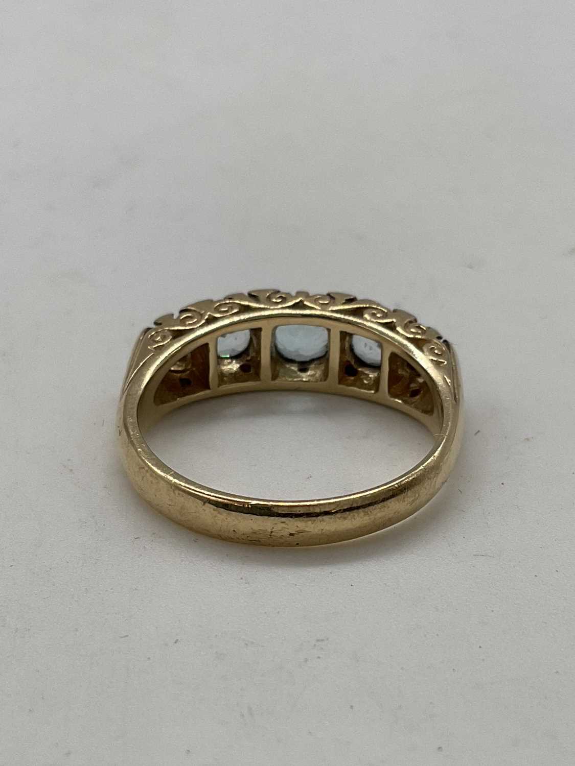 A 9ct yellow gold aquamarine and diamond ring with elaborate scroll mount, size P 1/2 , approx. 4. - Image 3 of 4