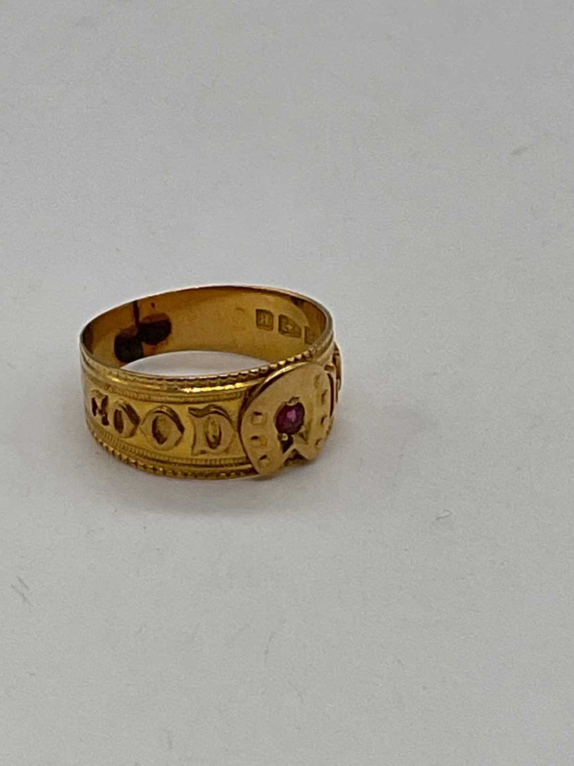 An 18ct yellow gold 'Good Luck' ring set with a ruby, size L, approx. 3.25g. Condition Report: The - Image 2 of 4