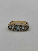 A 9ct yellow gold aquamarine and diamond ring with elaborate scroll mount, size P 1/2 , approx. 4.