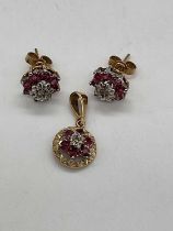 A yellow metal diamond and ruby circular flowerhead pendant with matching ear studs, combined