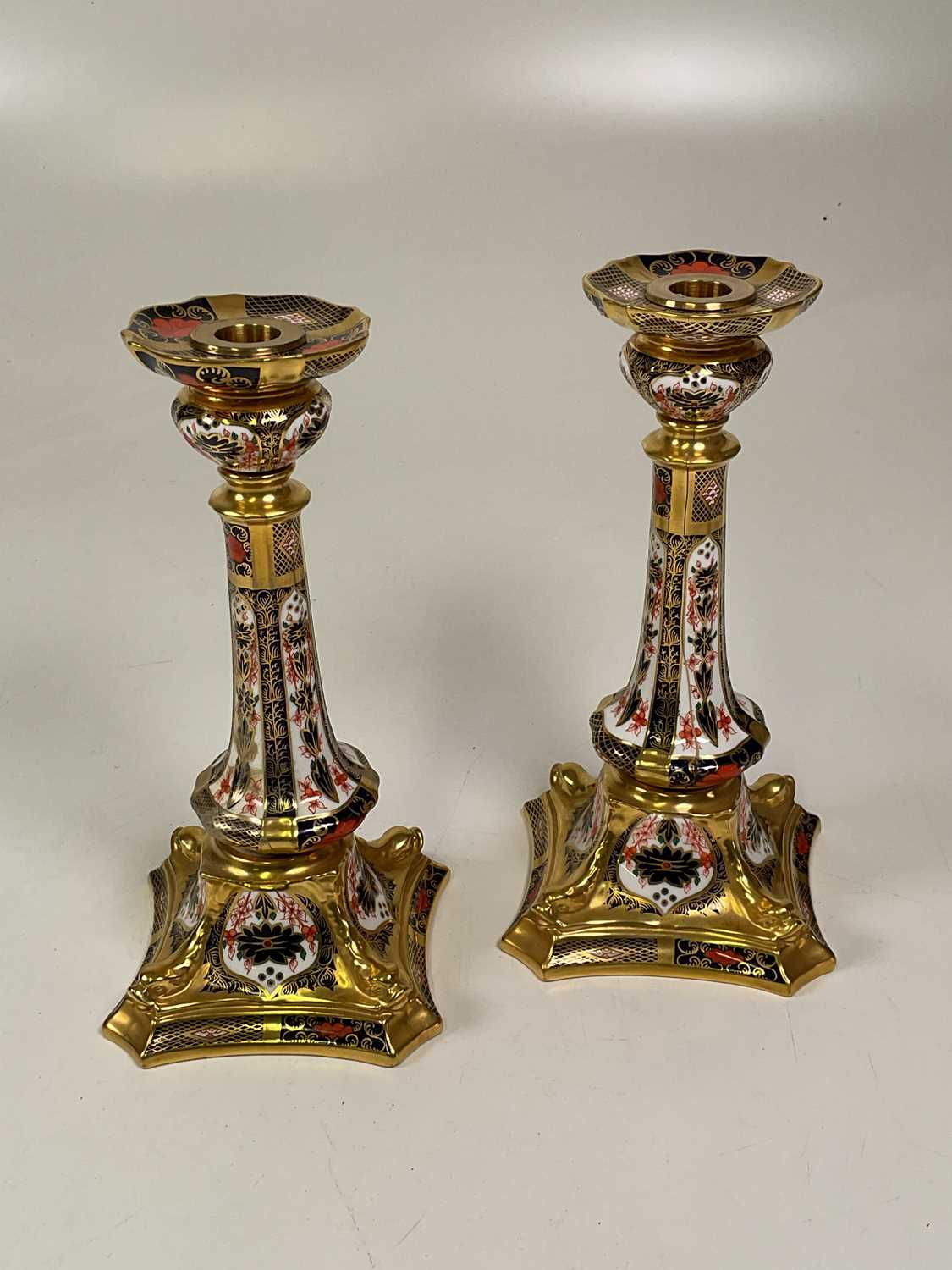 Royal Crown Derby pair of candlesticks Condition Report: The top part of the candlesticks are