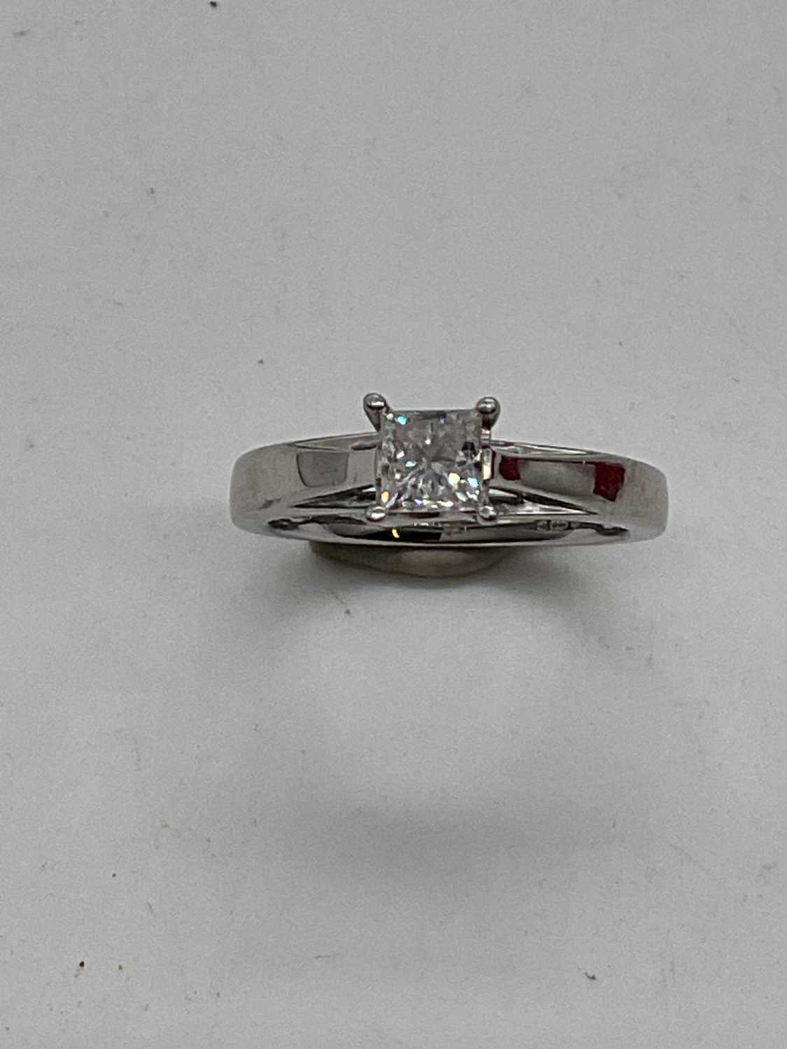 A platinum and diamond solitaire ring, the princess cut four claw set stone approx. 0.50cts,