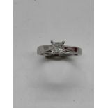 A platinum and diamond solitaire ring, the princess cut four claw set stone approx. 0.50cts,