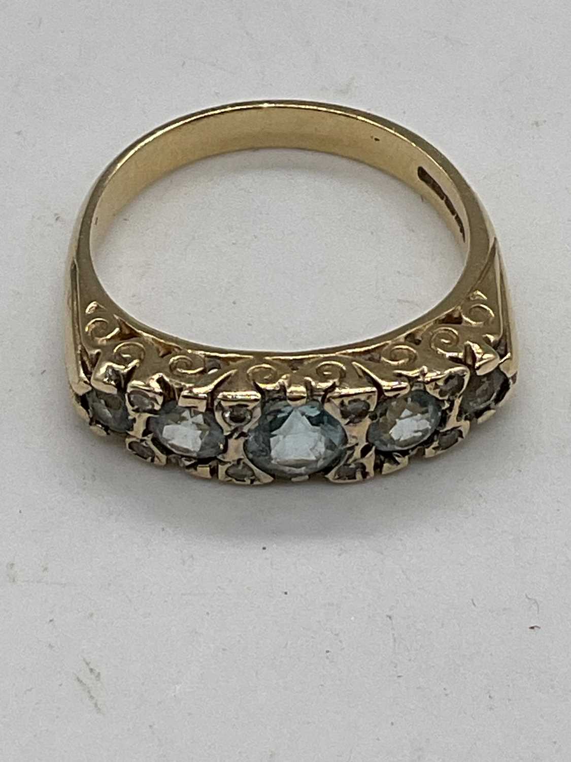 A 9ct yellow gold aquamarine and diamond ring with elaborate scroll mount, size P 1/2 , approx. 4. - Image 4 of 4