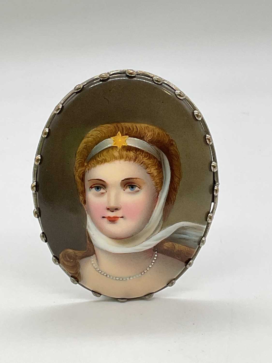 An oval porcelain hand painted plaque depicting Princess Louise, daughter of Queen Victoria and