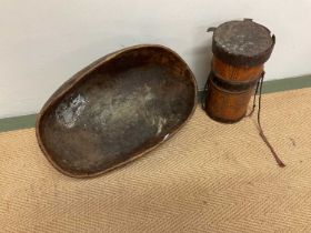 A Turkana wooden honey , height 27 cm, and an East African Turkana bowl, width 42, depth 25 cm.