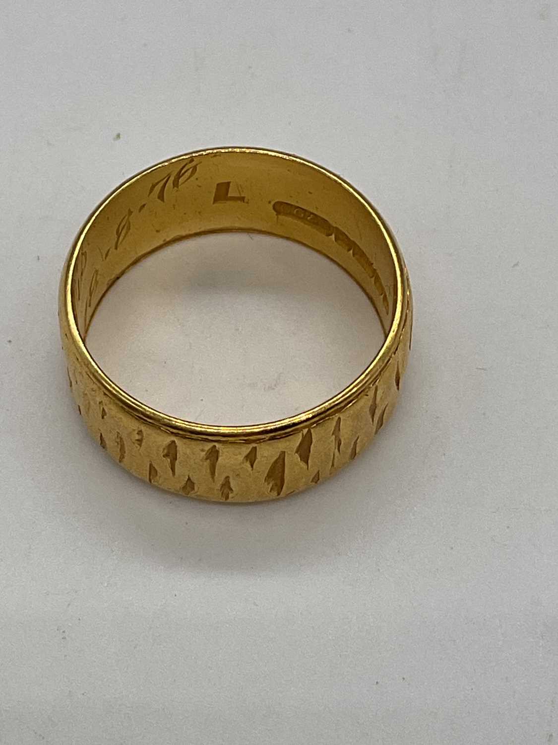 A 22ct yellow gold wedding band with engraved detail and inscription to the inner band, size K 1/ - Image 4 of 4