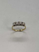 A 18ct yellow gold four stone diamond ring, the round brilliant cut stones totalling 1ct,