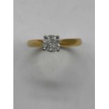 An 18ct yellow gold diamond solitaire ring, the four claw set round brilliant cut stone approx. 0.